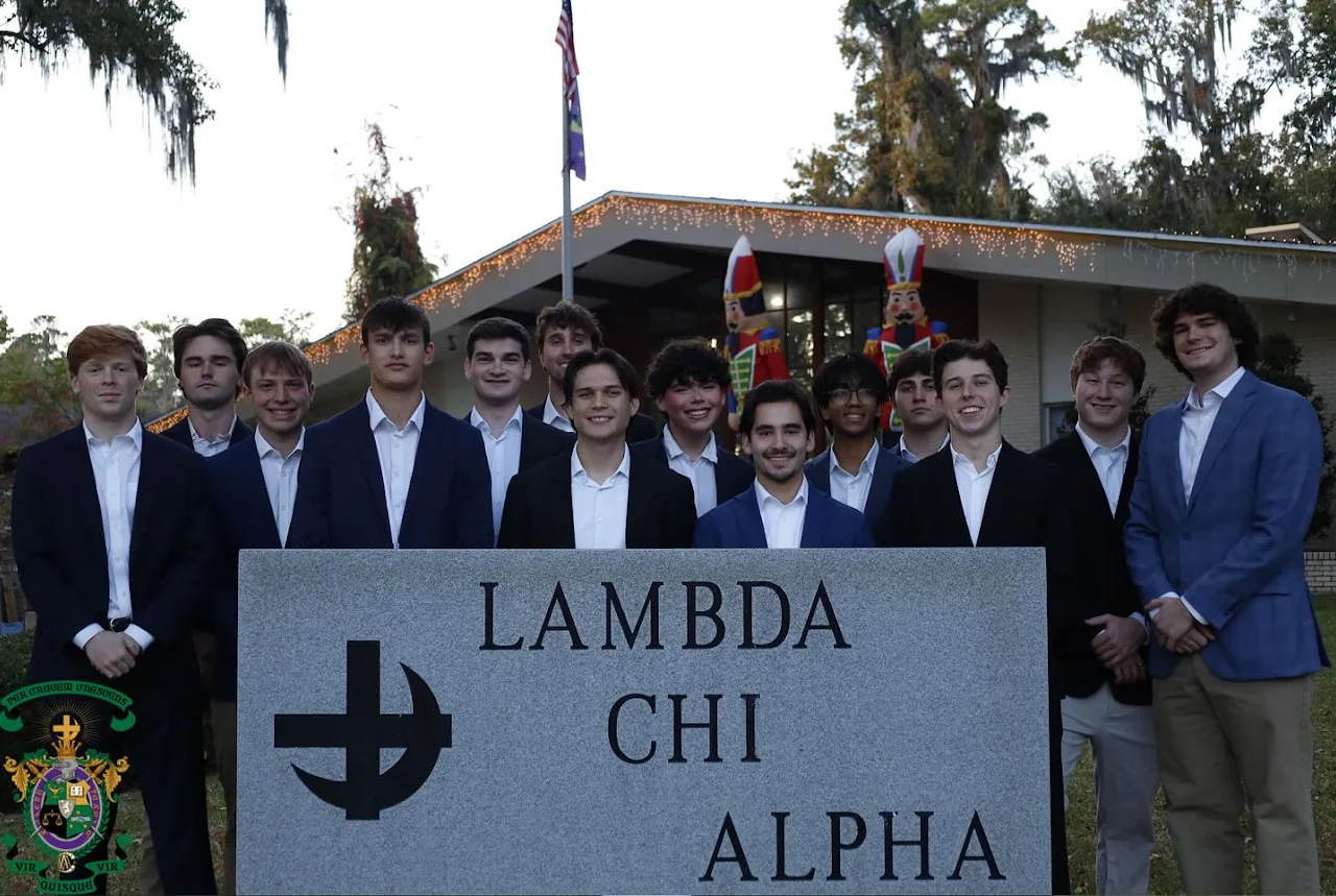 Epsilon-Mu brothers together in front of the chapter house